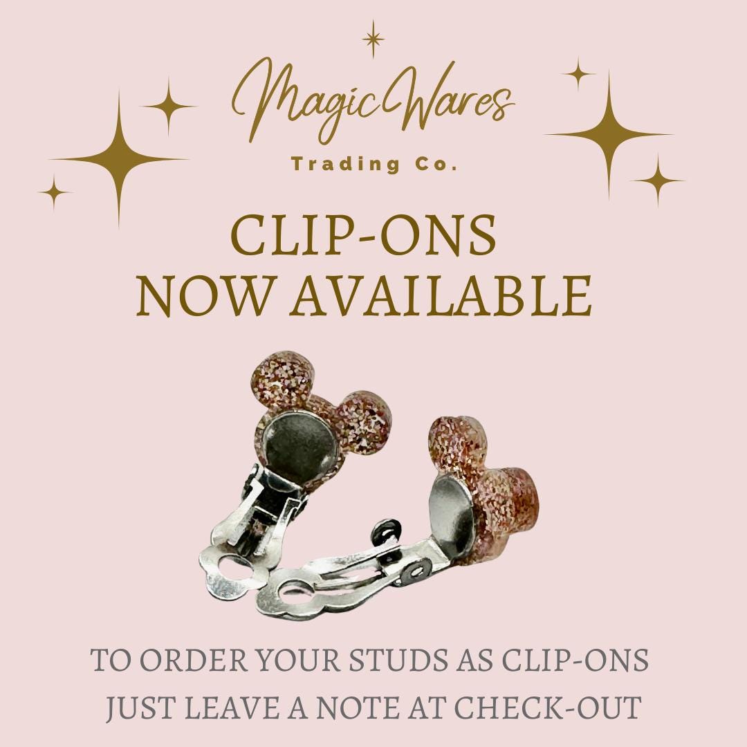 a picture of a pair of clip - ons on a pink background