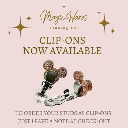 a picture of a pair of clip - ons on a pink background